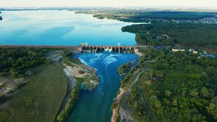 Fototapeta na wymiar Aerial panorama of Dam at reservoir with flowing water, hydroelectricity power station, drone photo.