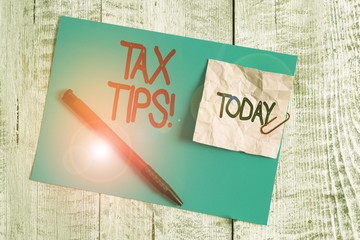 Text sign showing Tax Tips. Business photo showcasing compulsory contribution to state revenue...