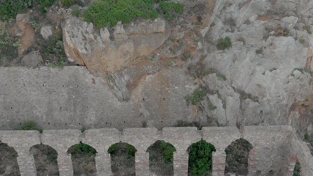 Beautiful and overgrown Church remains, Buggerru, Sardinia, Aerial view