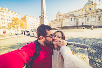 Fototapeta premium happy handsome tourist couple taking selfie in Rome, capital of Italy
