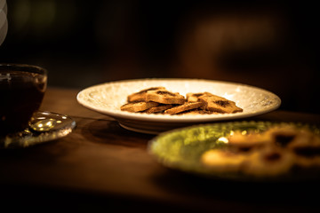 Tea cups with thin cream wafers. Teas with hot smoke. Fine cookies with accompanying special teas.