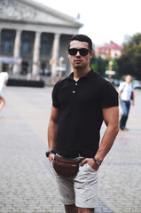  Guy in black polo and sunglasses.Business portrait.