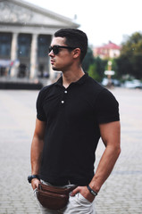  Guy in black polo and sunglasses.Business portrait.