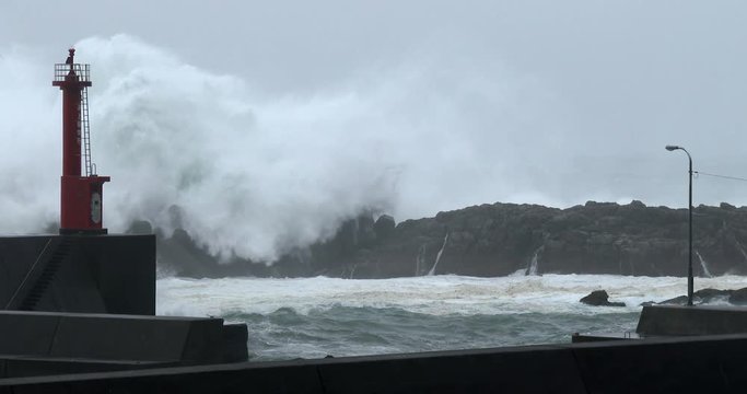 Huge Hurricane Waves Crash Over Sea Wall At Port - Halong