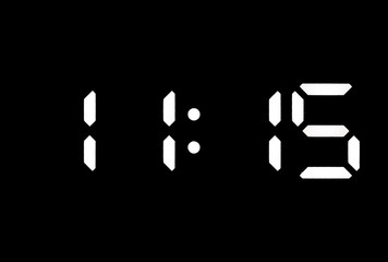 Real white led digital clock on black background