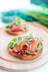 Tasty italian bruschetta on the wooden plate