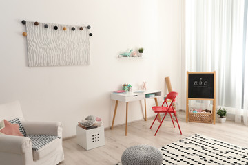 Modern child room interior with stylish furniture