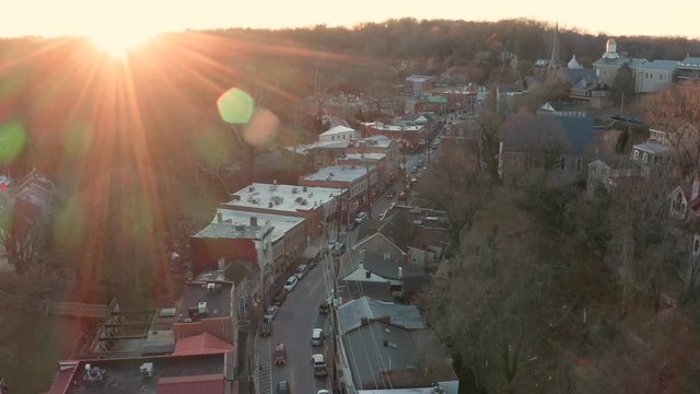 Aerial drone footage of Old Ellicott City, Maryland taken during the winter at sunset