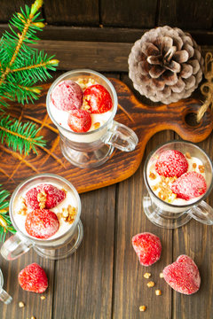 Strawberry yogurt with cornflakes and fresh berries, top view, vertical image
