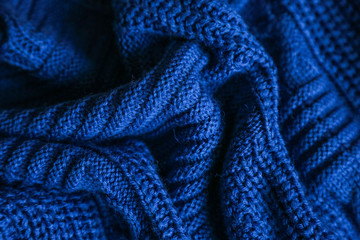  Classic blue dark knitted background. Close up texture . wrinkled and shadows, top view. 2020 trend color