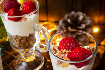 Strawberry yogurt mousse in glass on illumination table close up