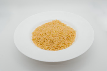 Pasta on a plate white background close-up