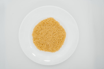 Pasta on a plate white background close-up