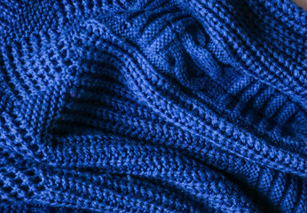  Classic blue dark knitted background. Close up texture . wrinkled and shadows, top view. 2020 trend color