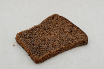 Slice of bread on a white background close-up