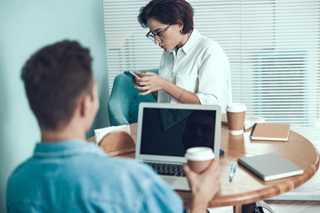 Young employees are sitting in the office