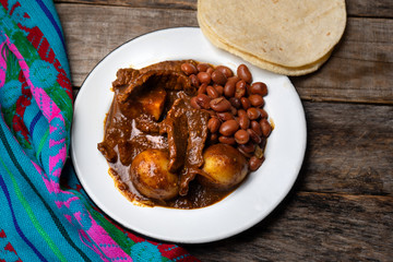Mexican beef steak with potatoes and pasilla pepper sauce