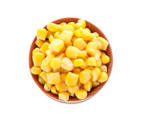 Delicious canned corn in bowl isolated on white, top view