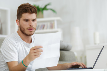 young man reading love letter on laptop