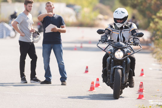 motorcyclist during driving lesson on motordrome