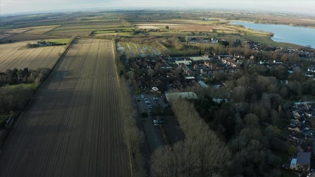 Aerial footage of Hornsea Freeport clothes outlet from above during morning sunrise in Winter