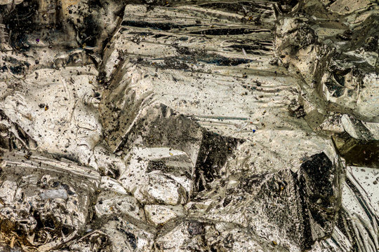 Exteme macro with 10x magnification of a Pyrite surface. The mineral pyrite also known as fool's gold, is an iron sulfide (the frame width is 2.2mm)