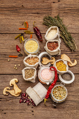Zero waste food shopping concept. Cereals, pasta, legumes, dried mushrooms, spices. Sustainable lifestyle, old wooden boards background