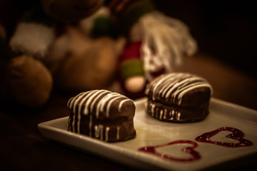 Christmas sweets in rustic cafeteria environment. Typical South American sweet known as gingerbread. Christmas decoration with chocolate candy.