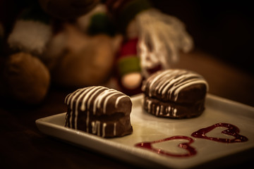Christmas sweets in rustic cafeteria environment. Typical South American sweet known as gingerbread. Christmas decoration with chocolate candy.