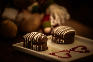 Christmas sweets in rustic cafeteria environment. Typical South American sweet known as gingerbread. Christmas decoration with chocolate candy.