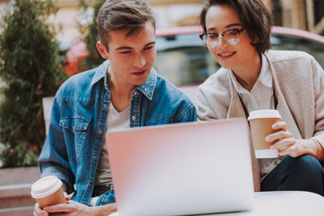 Two colleagues spending time in cafe on the street