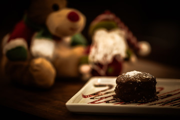 Christmas sweets in rustic cafeteria environment. Typical South American sweet known as gingerbread. Christmas decoration with chocolate candy.