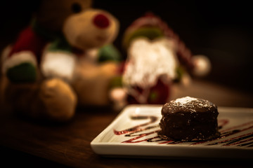 Christmas sweets in rustic cafeteria environment. Typical South American sweet known as gingerbread. Christmas decoration with chocolate candy.