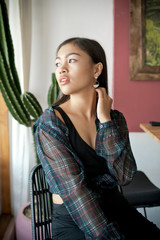 Asian smile girl in a cafe. Beautiful Balinese women