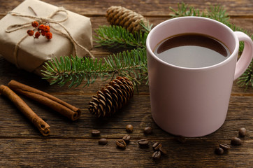 Fototapeta na wymiar Christmas coffee with christmas gift on wooden table