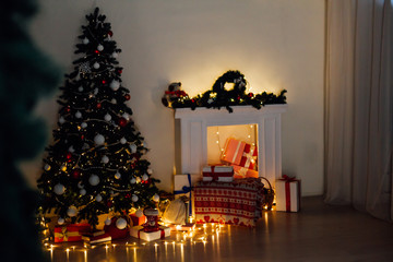 Christmas tree with lights light Garland and gifts for the new year