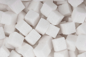 White sugar cubes background top view texture