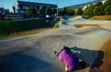 Sporty man laying after practicing parkour