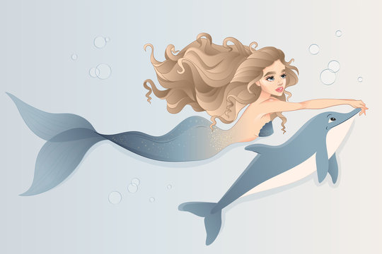 Mermaid with dolphin swimming in the sea