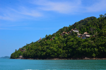 Tropical Jungle and resort on top of mountain sea side