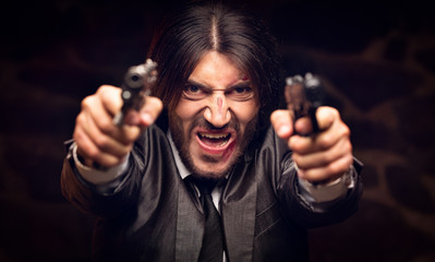 aggressive man with a gun