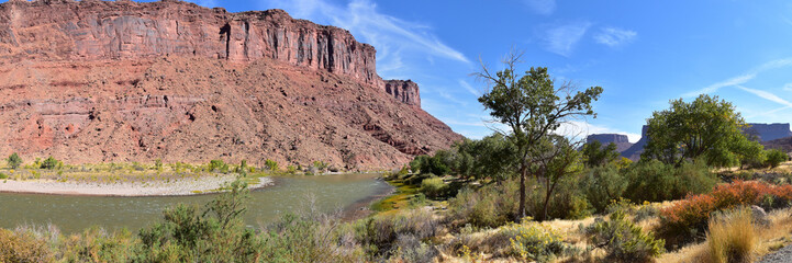 Moab Panorama views of Colorado River Highway UT 128  in Utah around  Hal and Jackass canyon and Red Cliffs Lodge on a Sunny morning in fall. Scenic nature near Canyonlands and Arches  National Park, 