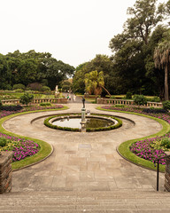 Cupid Statue Garden of love many flowers, lake, water, fountain.  Cupido do amor estatua . Jardim do amor muitas flores, lago, agua, chafariz