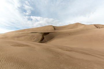 Fototapeta na wymiar Landscape view of dunes at Great Sand Dunes National Park in Colorado, the tallest sand dunes in North America.