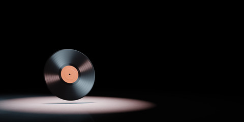 Vinyl Record Spotlighted on Black Background