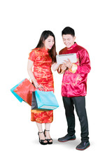 Obraz premium Asian man promoting some offerings to the woman