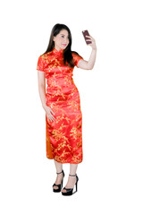 Beautiful Asian woman taking selfie in a cheongsam