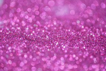 Pink and purple glitter, Defocused abstract holidays lights With Sparkle for background.