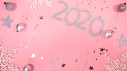 2020 Christmas and new year background banner with the beautiful decor gift for holiday in winter. On bright pink, golden and silver color theme with snow flake. top view with copy space.