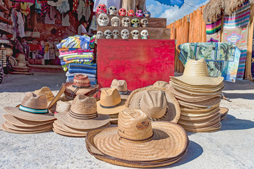 Street market selling hats, skulls, and blankets
